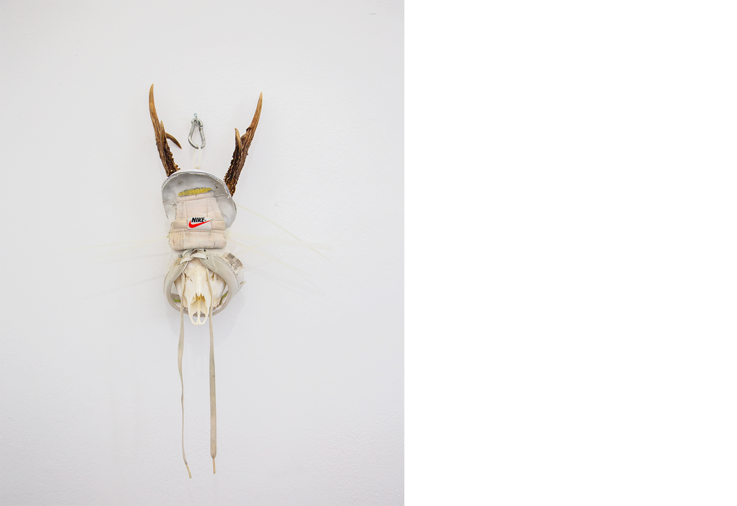 Exhibition views — Idol #6- Mask, 2025 | Mixed media, bones, metal ties, plastic sneakers. 40x30x20.