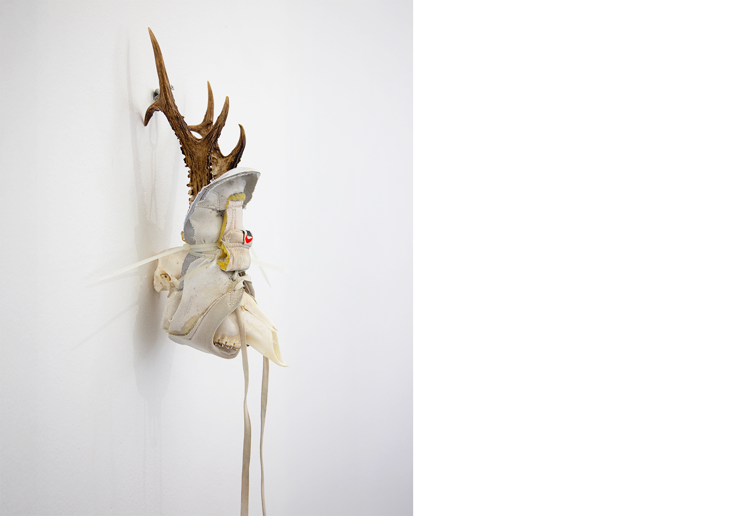 Exhibition views — Idol #6- Mask, 2025 | Mixed media, bones, metal ties, plastic sneakers. 40x30x20.