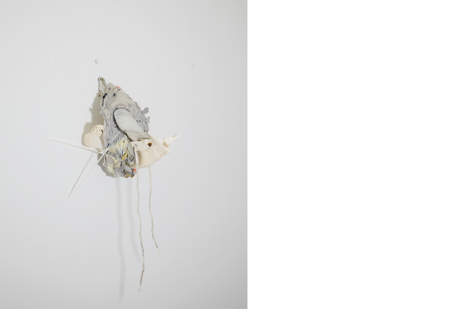Exhibition views — Idol #8- Pork Mask, 2025 | Mixed media, bones, metal ties, plastic sneakers. 35x40x30