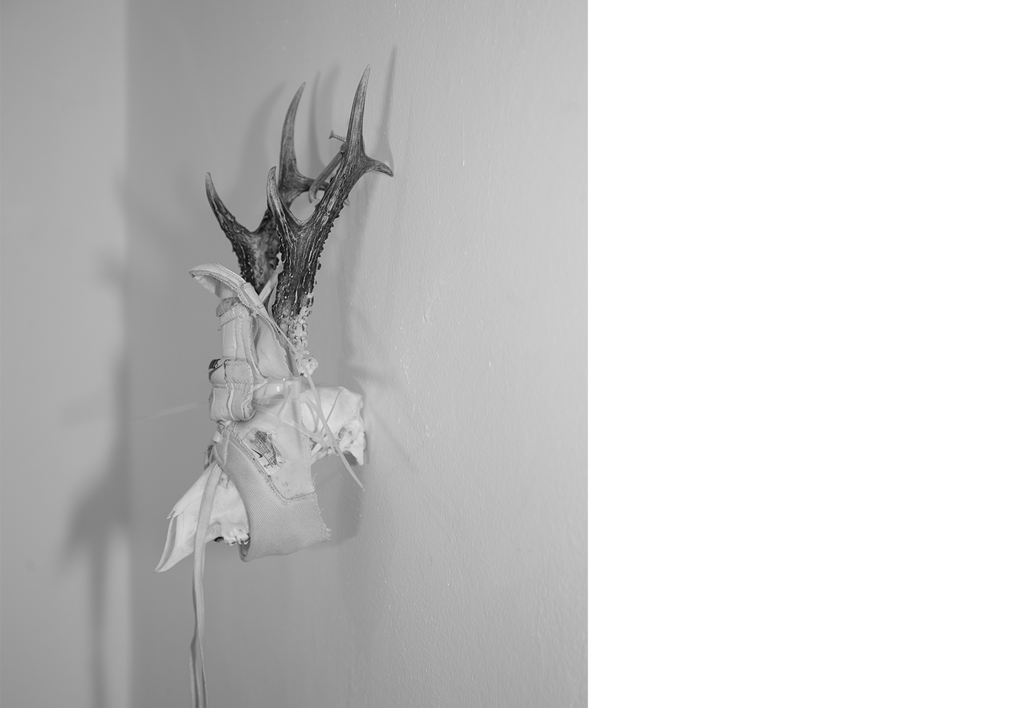 Exhibition views — Idol #6- Mask, 2025 | Mixed media, bones, metal ties, plastic sneakers. 40x30x20.