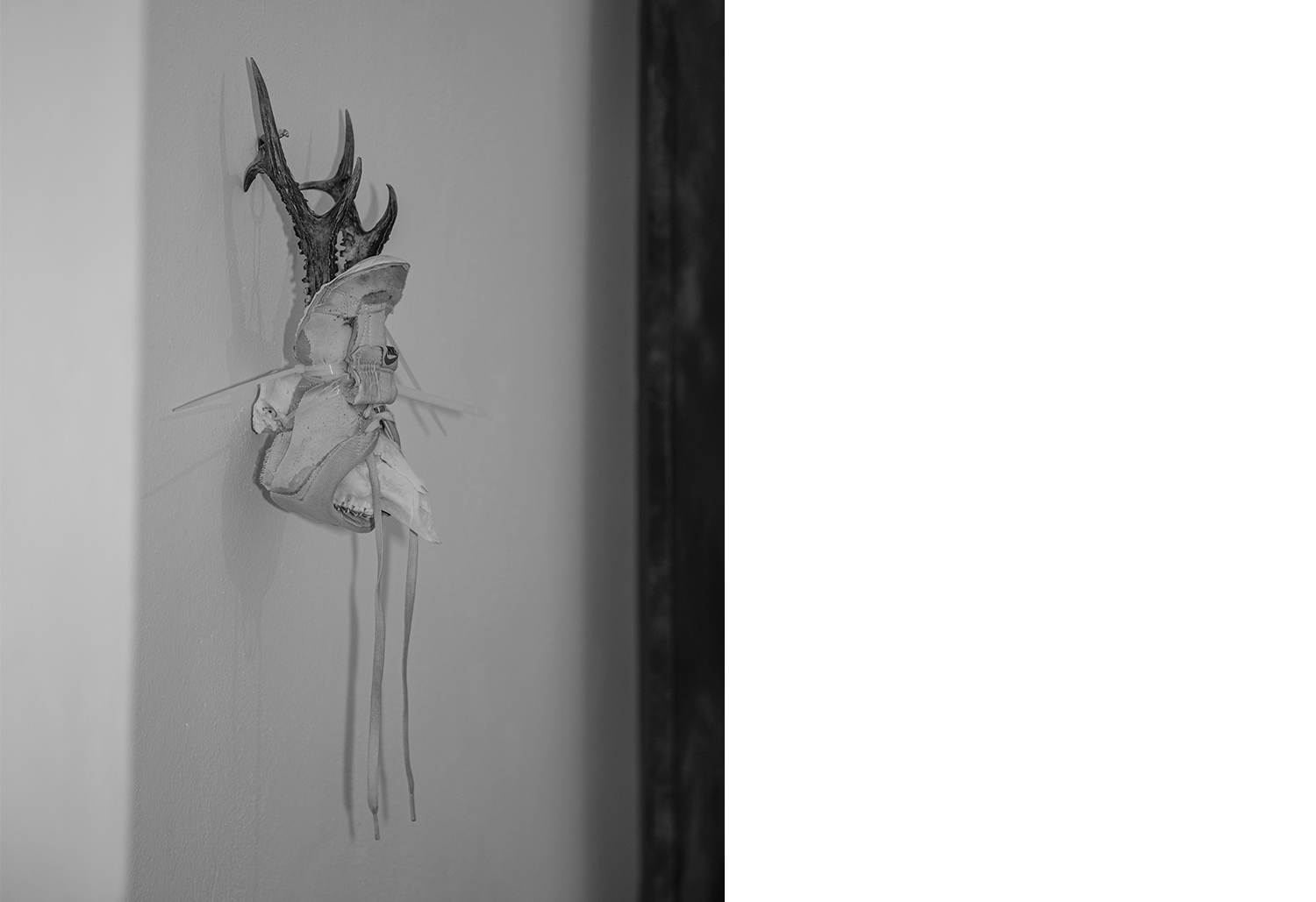 Exhibition views — Idol #6- Mask, 2025 | Mixed media, bones, metal ties, plastic sneakers. 40x30x20.